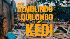 Fotografia mostra destroços de uma construção, tijolos e madeiras espalhados. Sobre a imagem o texto "Estão demolindo o Quilombo Kédi - Chamado para vigília"